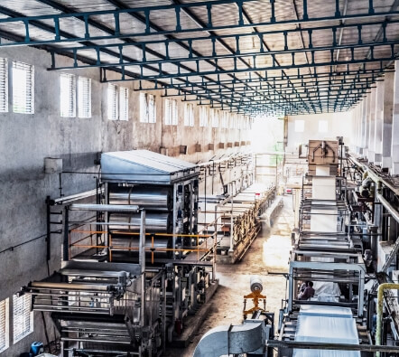 a warehouse filled with metal tooling, and a lot of natural light